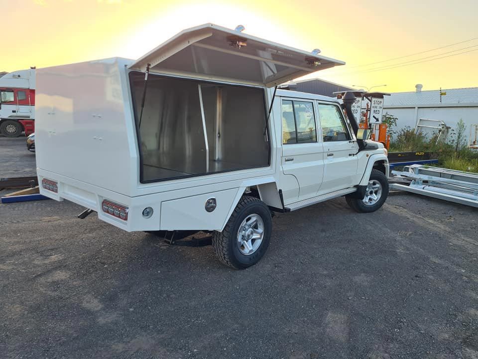 A White Truck With a Canopy is Parked in a Parking Lot —  SCF Industries Pty Ltd in Albion Park Rail, NSW