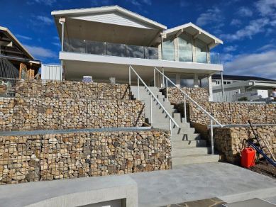 A Large House With Stairs Leading Up to It—  SCF Industries Pty Ltd in Albion Park Rail, NSW