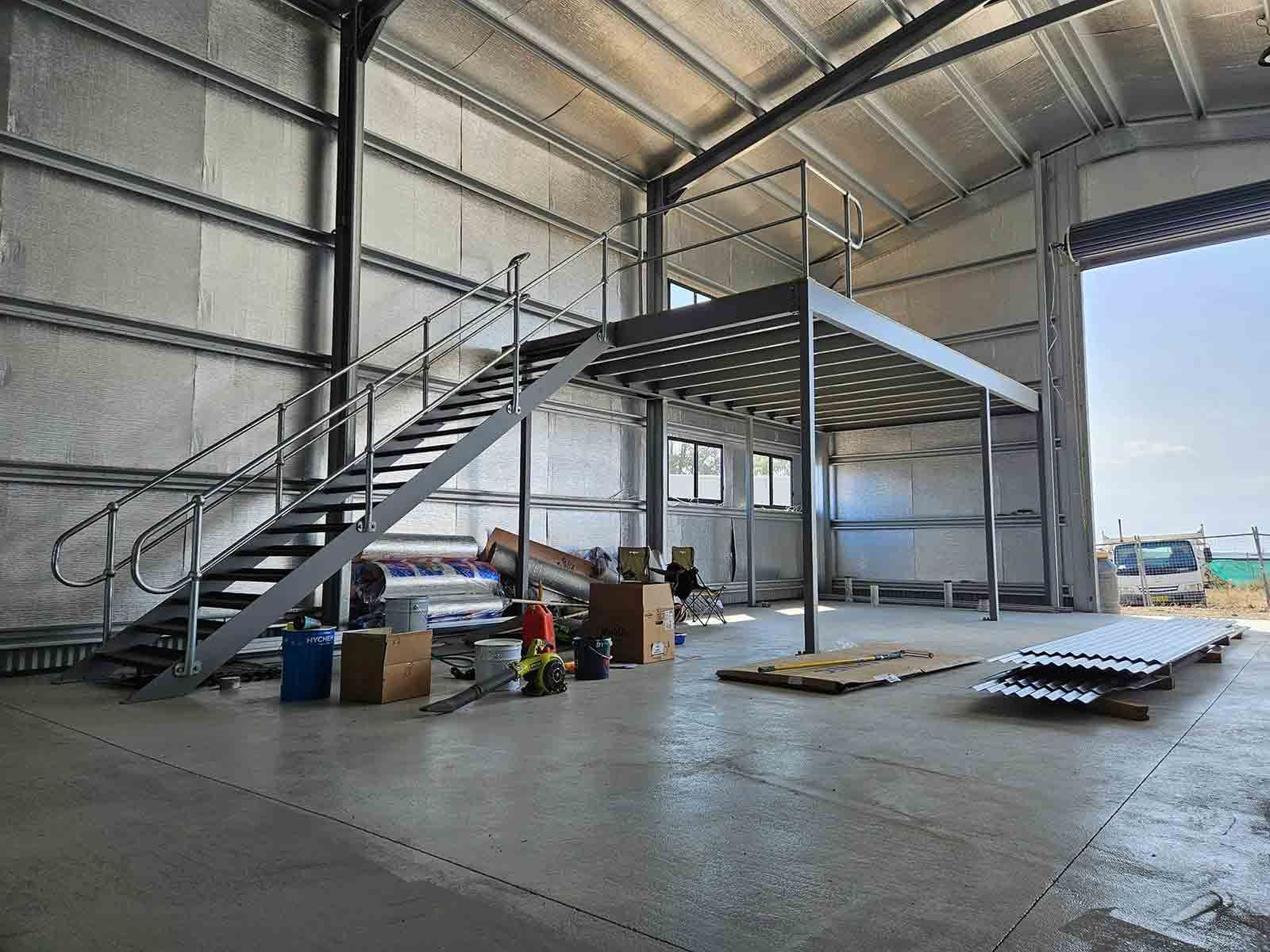 A Large Warehouse With Stairs Leading Up to a Second Floor—  SCF Industries Pty Ltd in Albion Park Rail, NSW