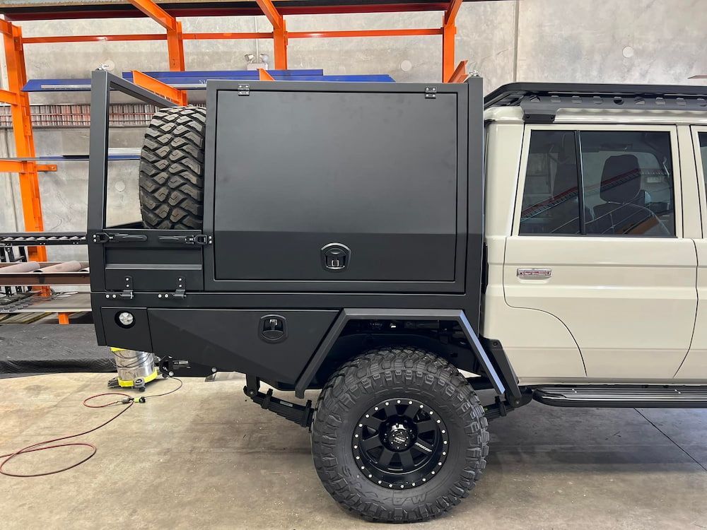 A White Truck With a Black Box on the Back is Parked in a Garage —  SCF Industries Pty Ltd in Shellharbour, NSW