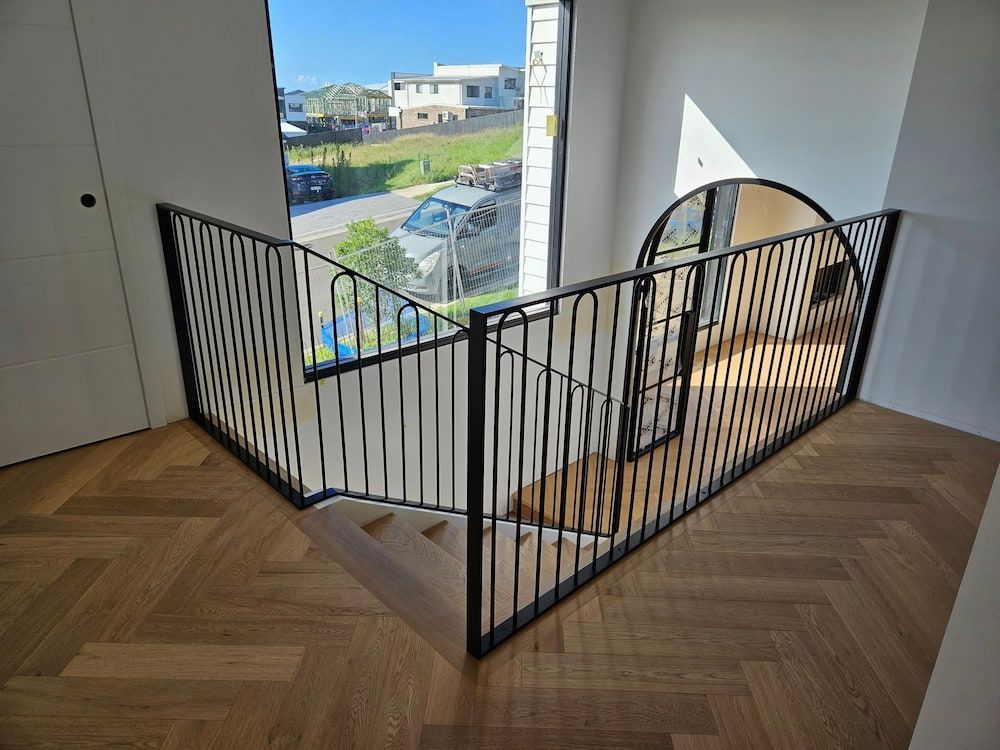 A Staircase With a Metal Railing and a Wooden Floor in a House —  SCF Industries Pty Ltd in Albion Park, NSW
