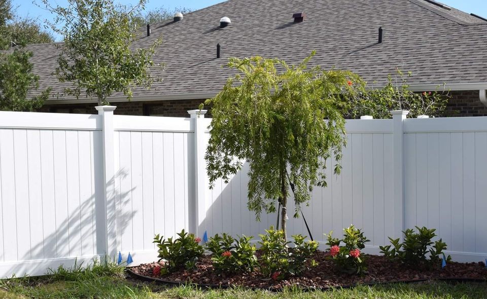 Garden with High Fence — Melbourne, FL — Eau Gallie Wholesale Nursery Inc.