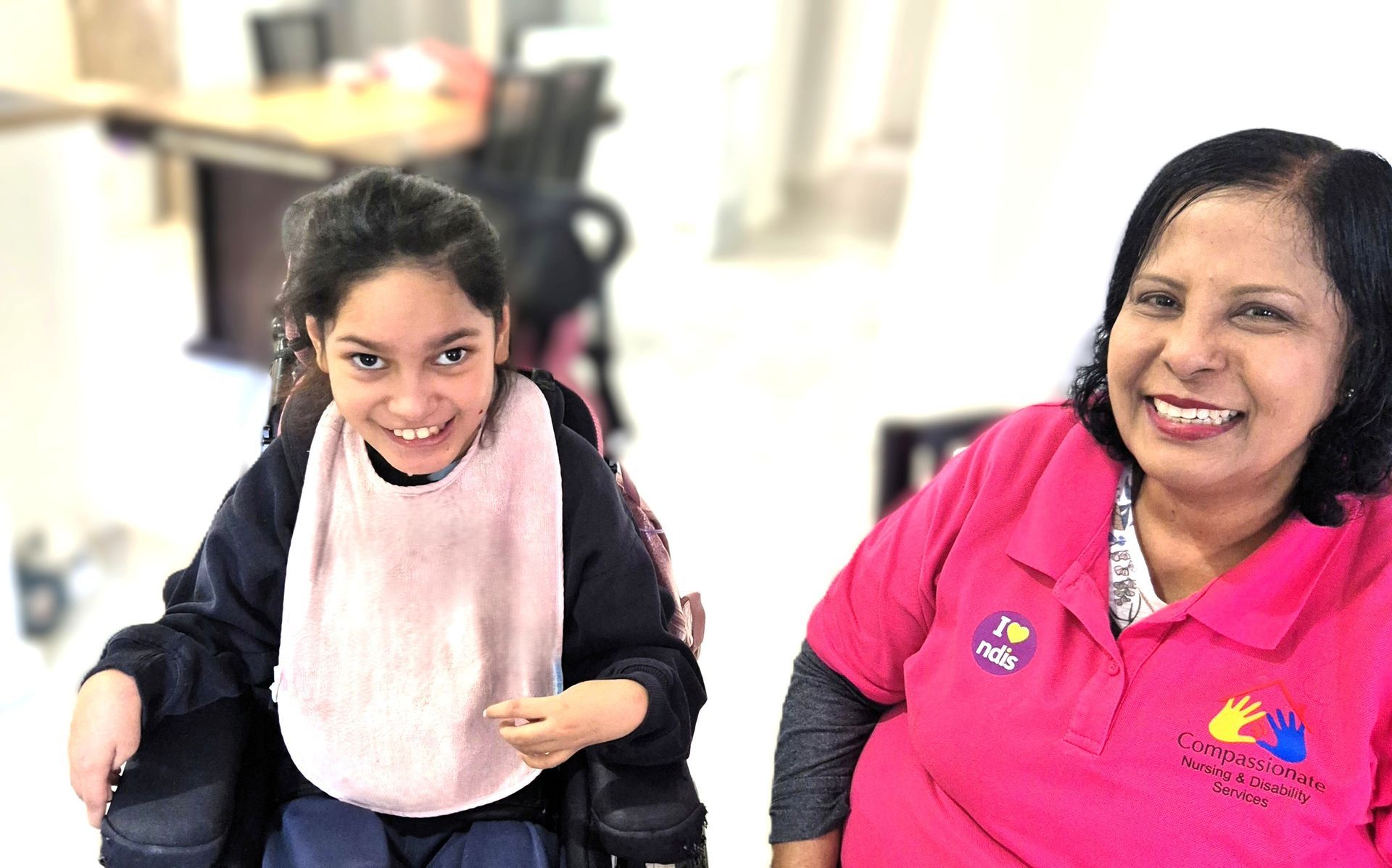 Assistance for Disabled Care disabled child in a wheelchair with a care assistant