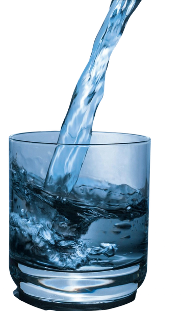 Water is being poured into a glass on a white background