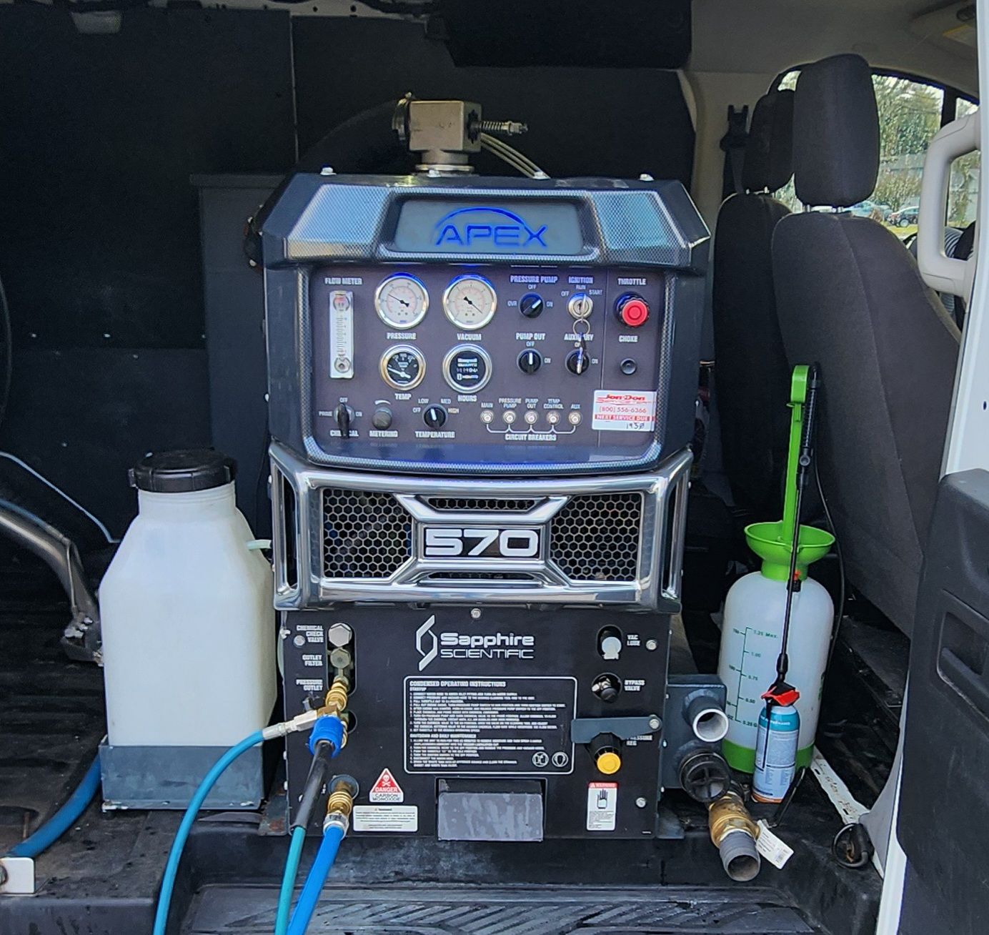 An apex machine is in the back of a van