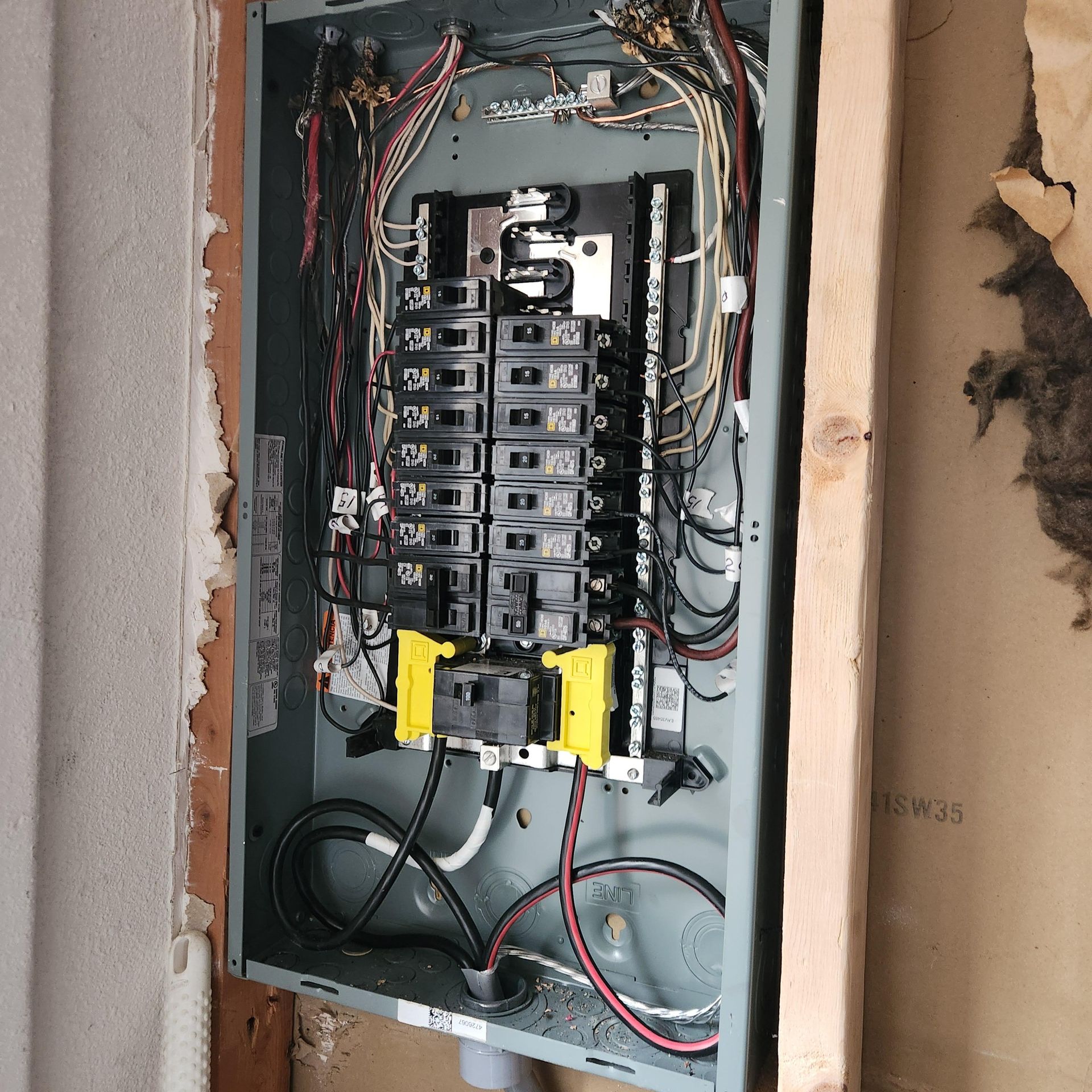 A electrical box with a lot of wires coming out of it
