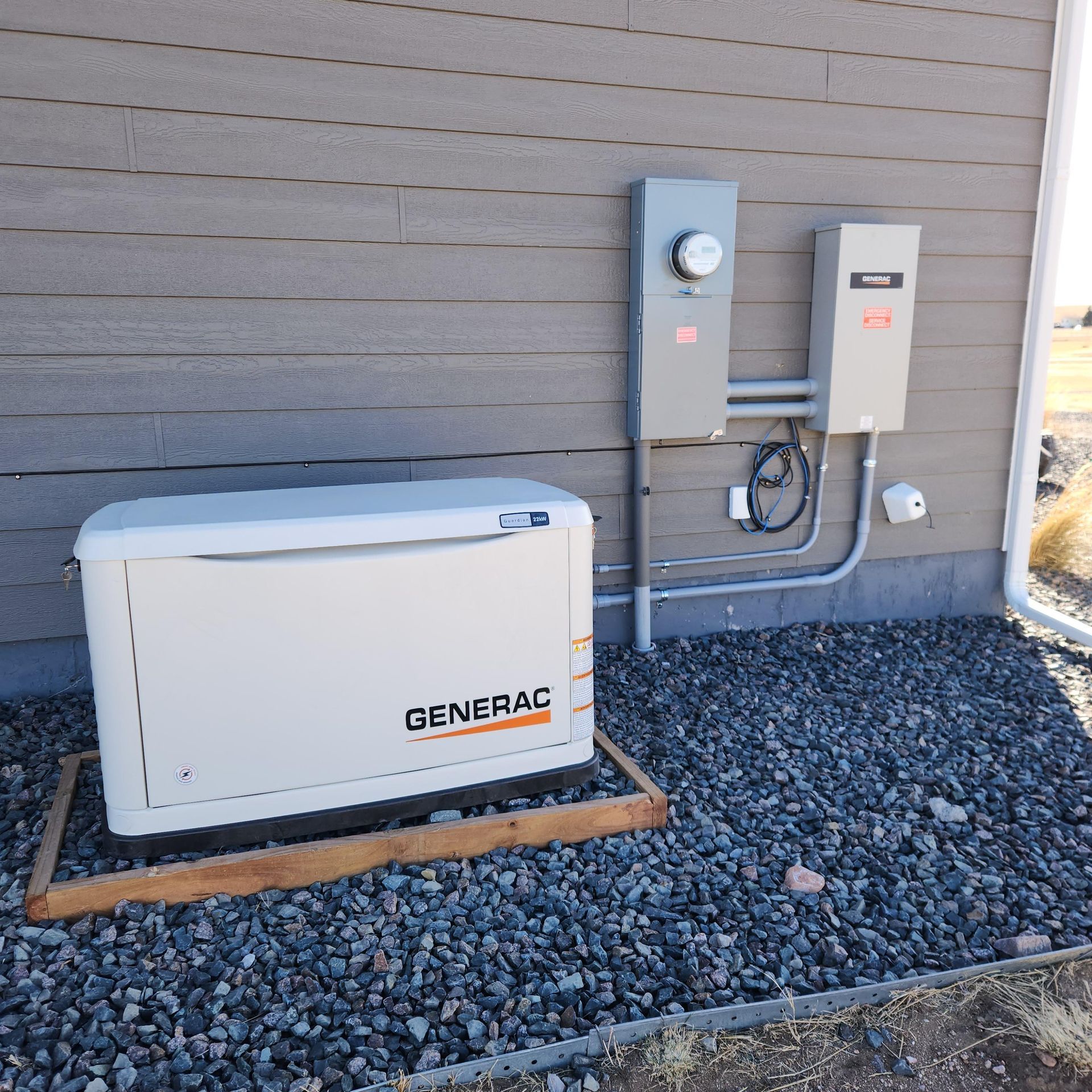 A generac generator is sitting outside of a house