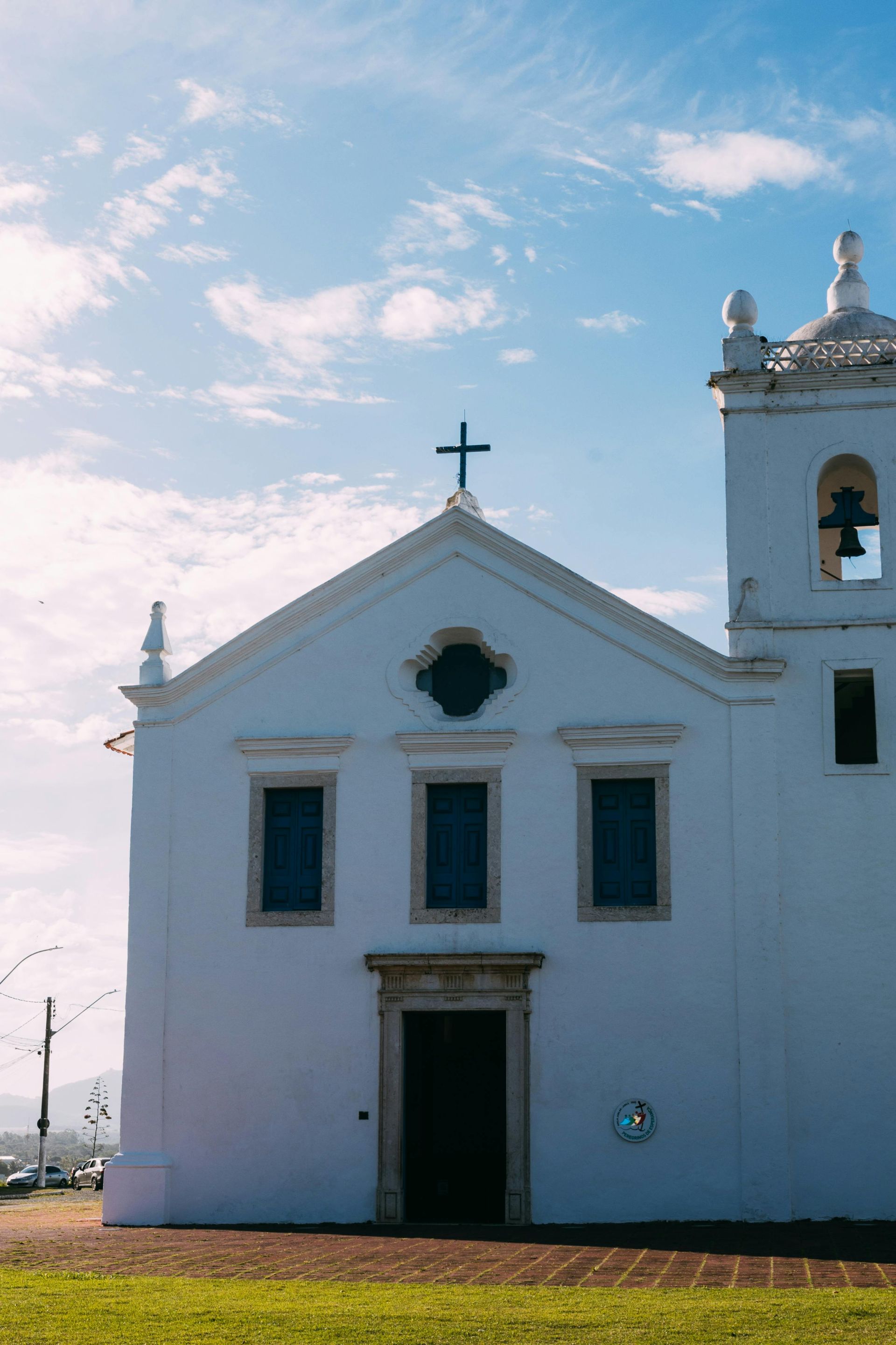 A pressure washer sprays water onto a wooden deck to clean its surface.