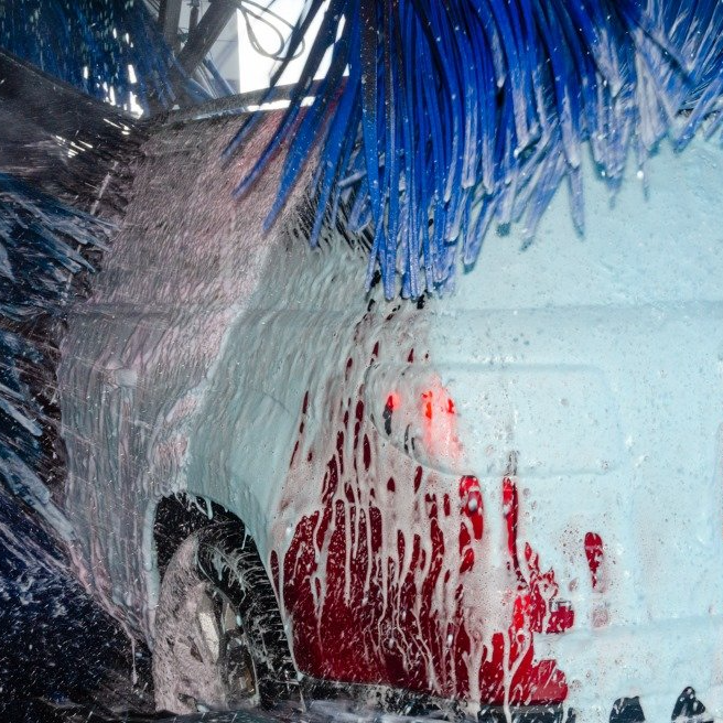 brushes in action on a vehicle in the car wash