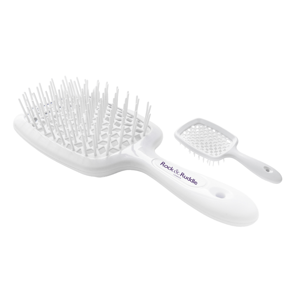 A white hair brush and comb on a white background.