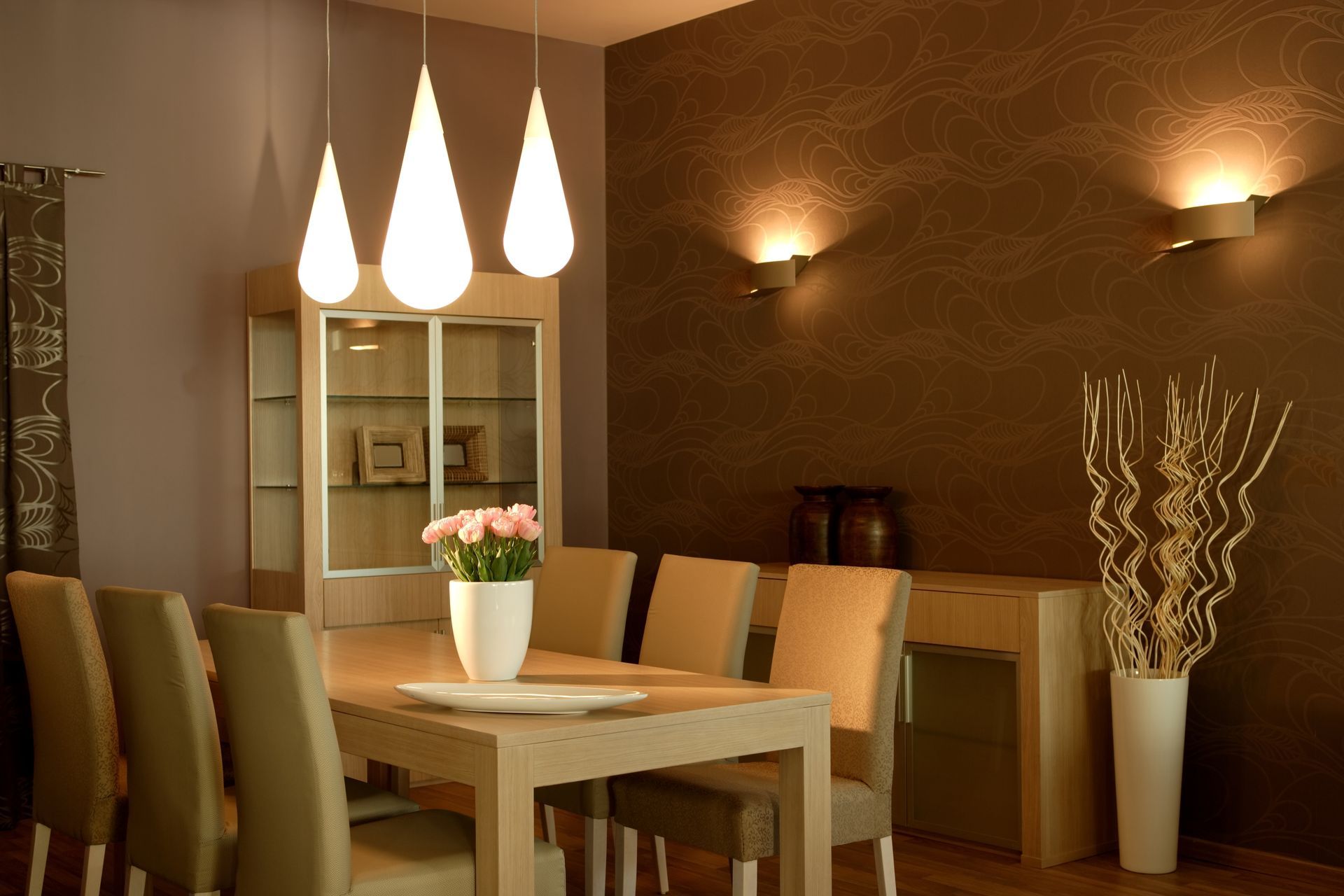 Dining room with light wood table, chairs, and cabinets — Ryphen Electrical in Highton, VIC