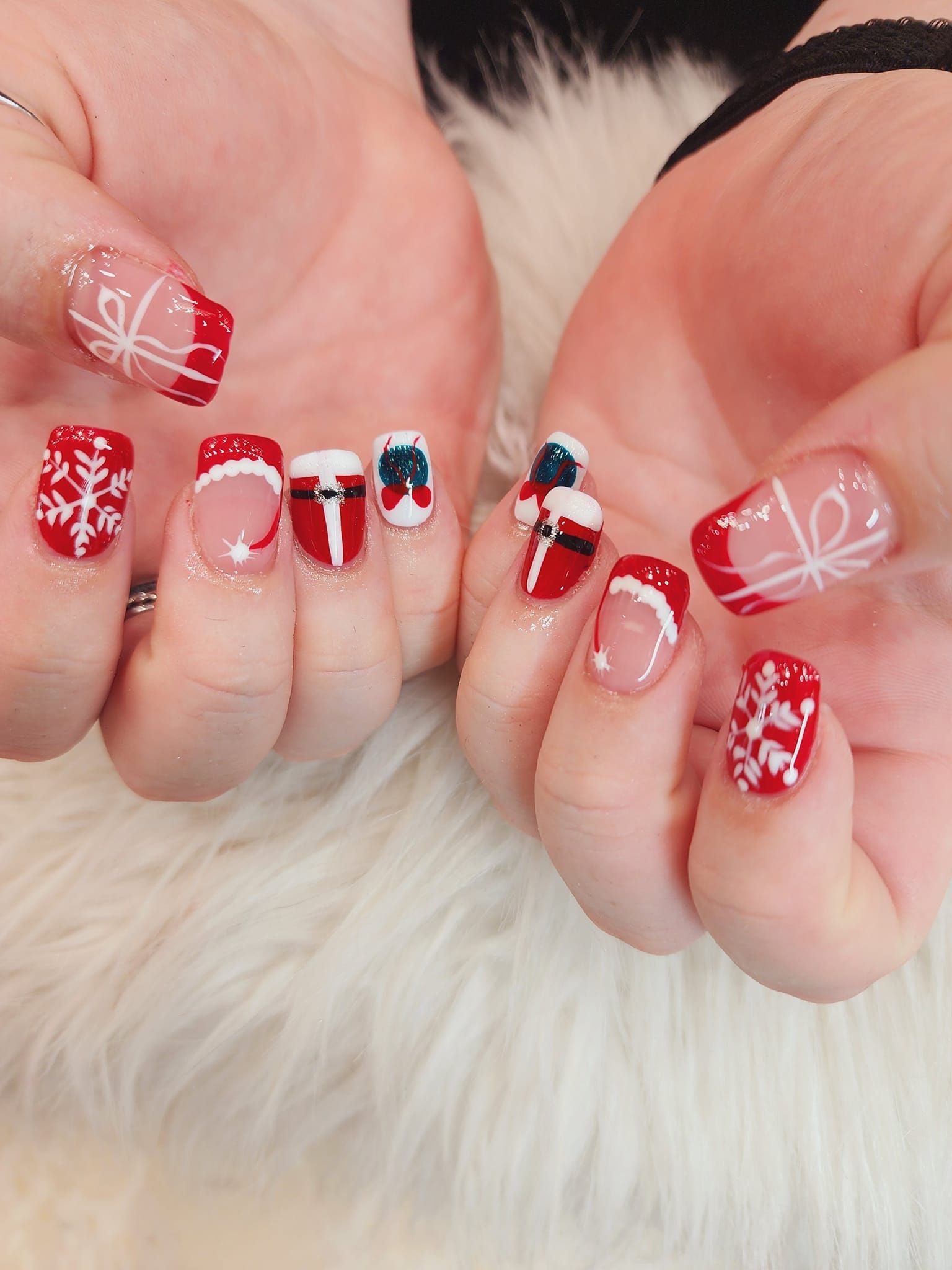A close-up of a person's nails with designs on them.