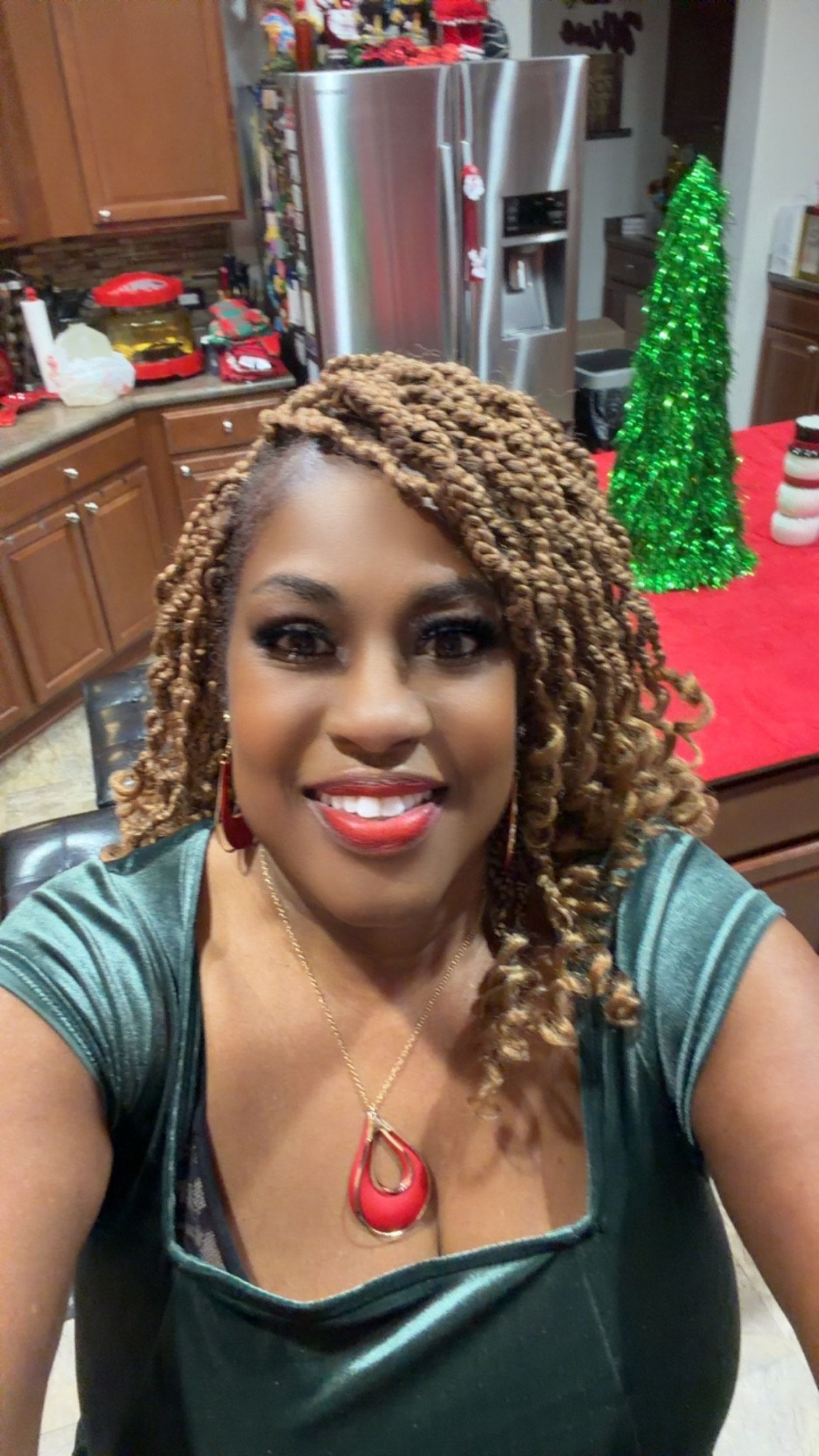 Two technicians repairing water damage: One kneels with a tool, the other adjusts a blower.