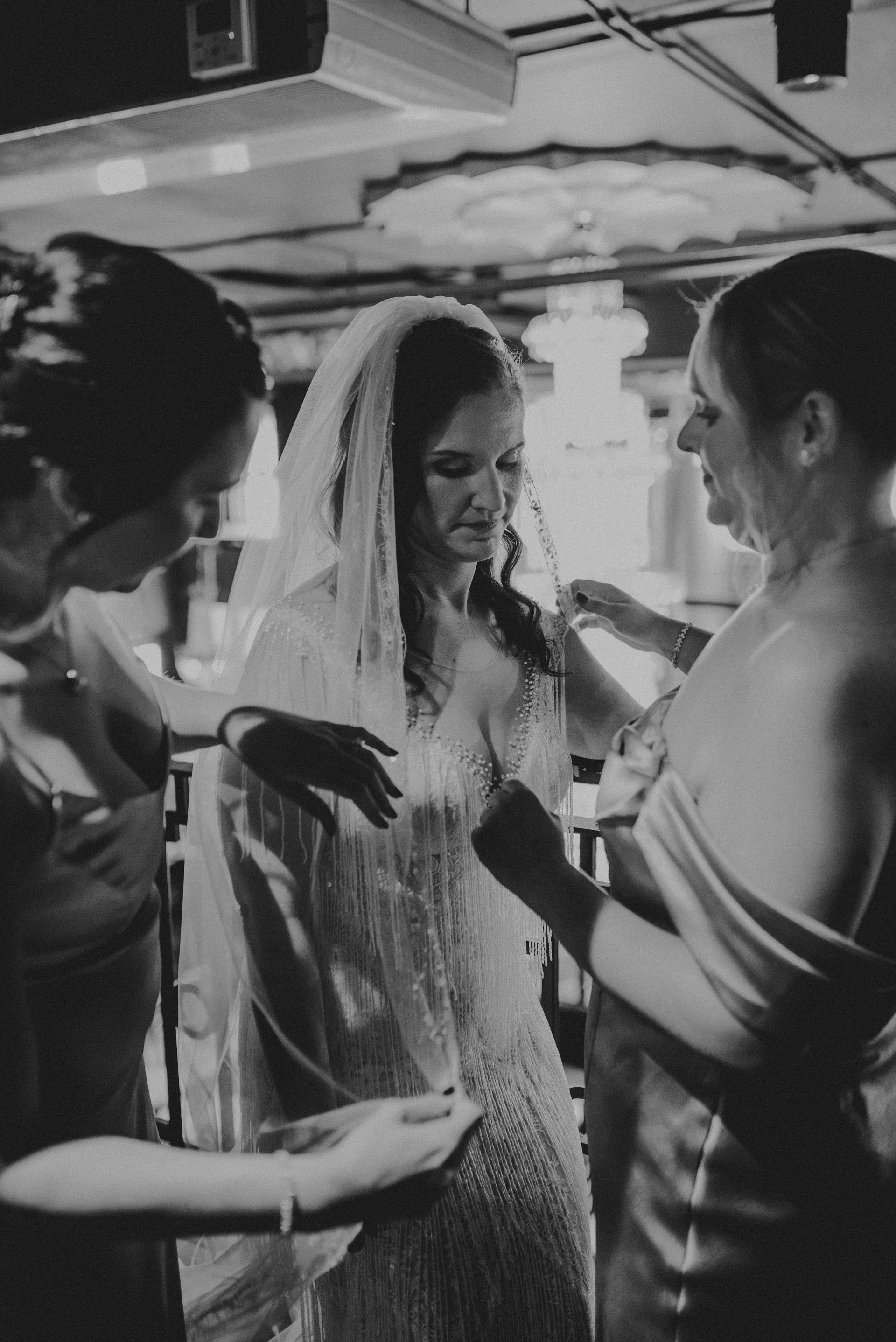 a black and white photo of a bride and her bridesmaids