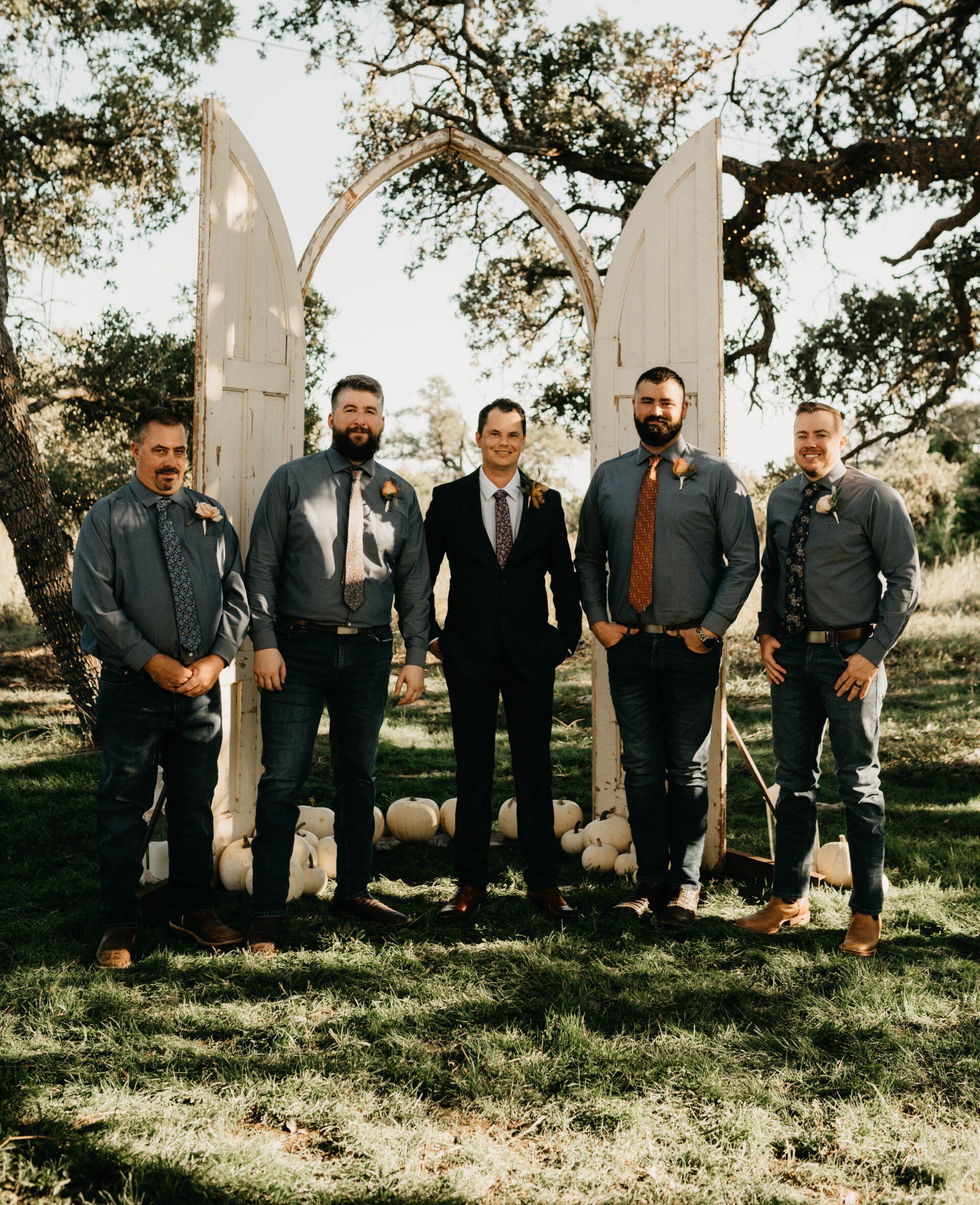the groom and his groomsmen are posing for a picture