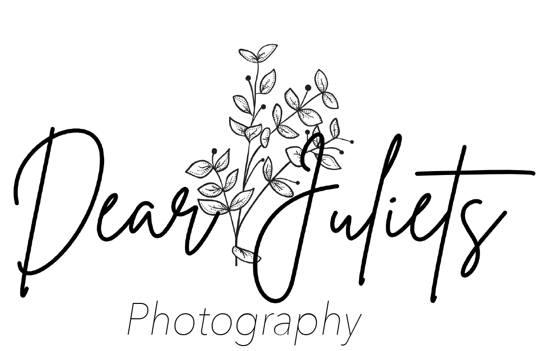 a black and white logo for dear juliets photography with flowers and butterflies .