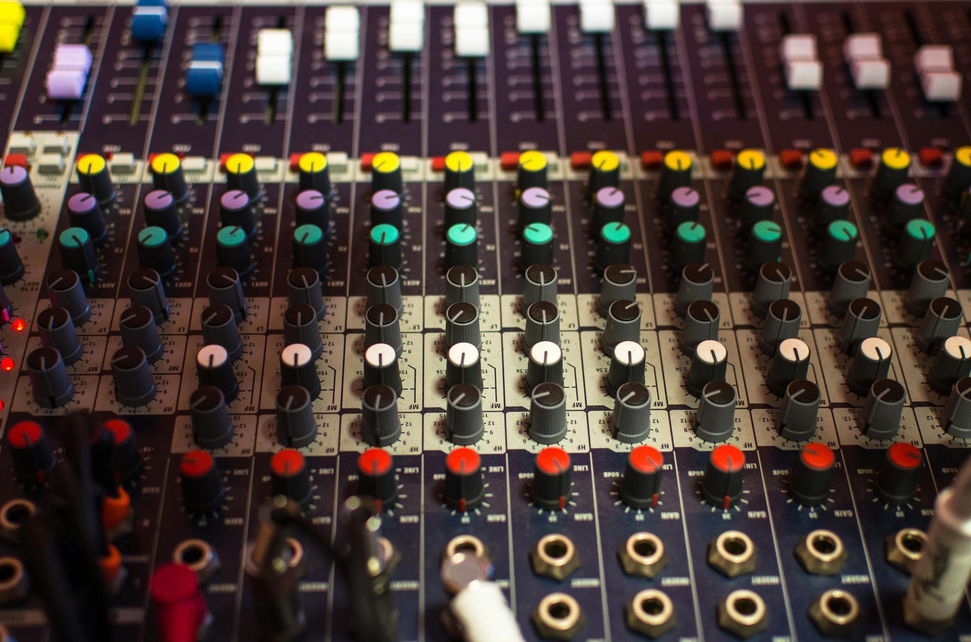 A mixer with a lot of knobs and buttons