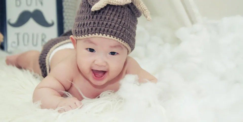 Cute Baby with Bonnet — Fairbanks, AK — Building Blocks