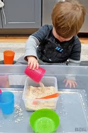 Little Boy Pouring Sand — Fairbanks, AK — Building Blocks