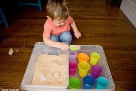 Little Girl Scooping Sand — Fairbanks, AK — Building Blocks