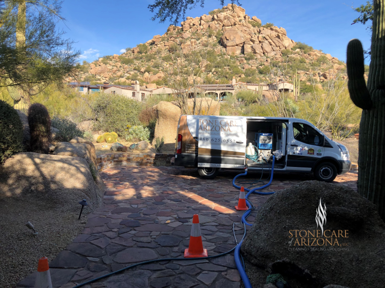 a van from stonecare arizona is parked in front of a mountain