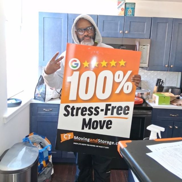 Person holding a sign promoting 