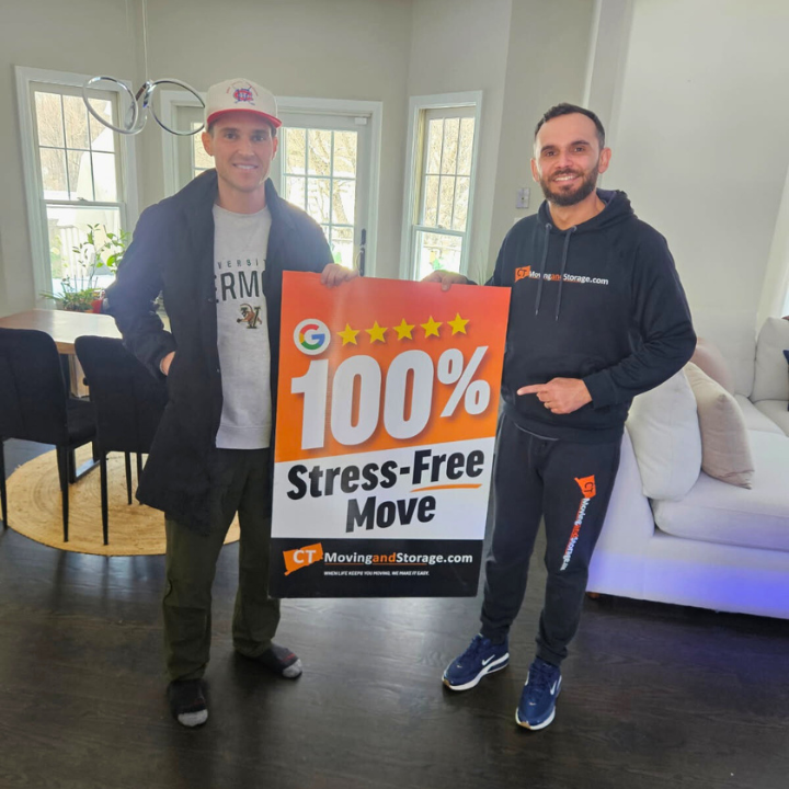 Two men holding a sign that says