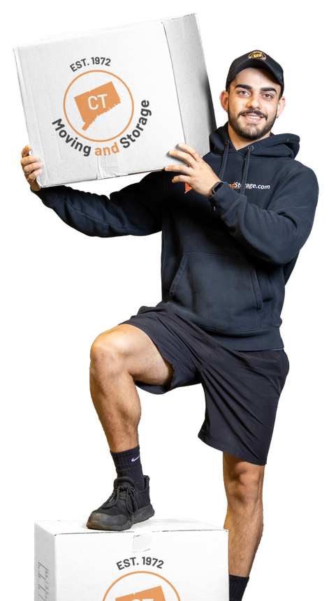 Man in black holding a box, standing on a box; both boxes have