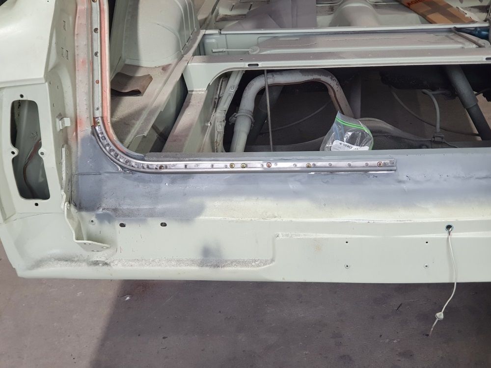 A White Car Is Being Built With A Metal Frame — East Coast Panel & Paint In Woolgoolga, NSW