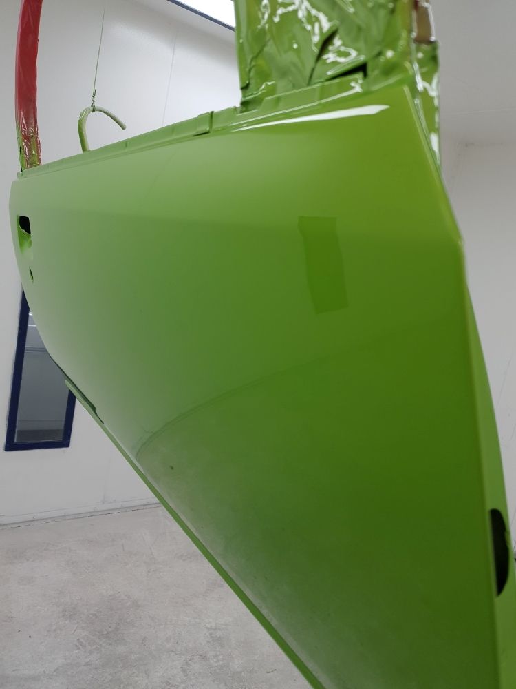 A Green Object Is Hanging From The Ceiling In A Room — East Coast Panel & Paint In Woolgoolga, NSW