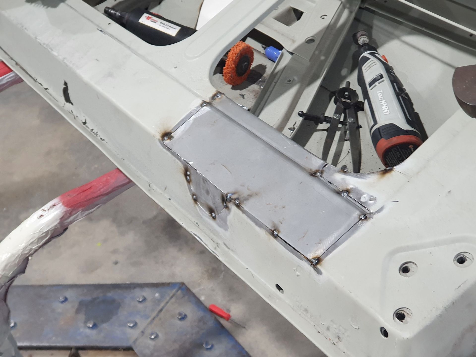 A Piece Of Metal Is Being Worked On In A Car — East Coast Panel & Paint In Woolgoolga, NSW