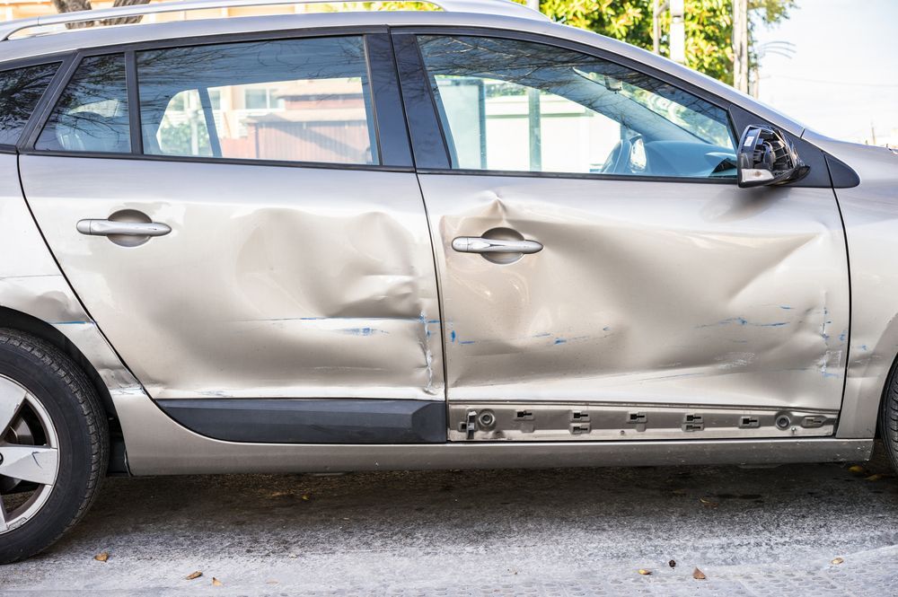 A Car with Damage and dent on side — East Coast Panel & Paint In Woolgoolga, NSW
