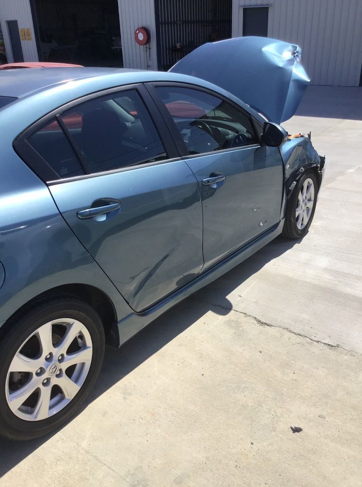 A Blue Car With The Hood Up Is Parked In A Parking Lot — East Coast Panel & Paint In Woolgoolga, NSW