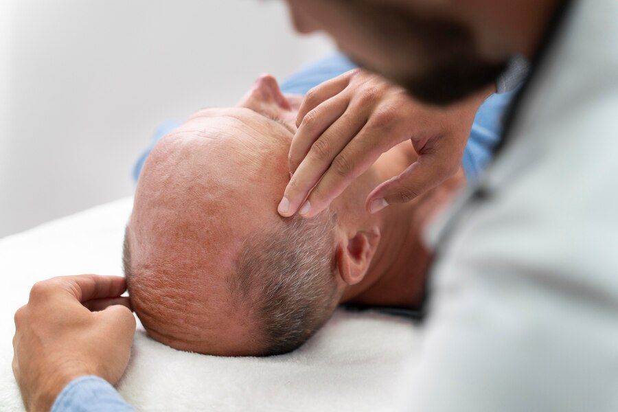 Male going through follicular unit extraction process