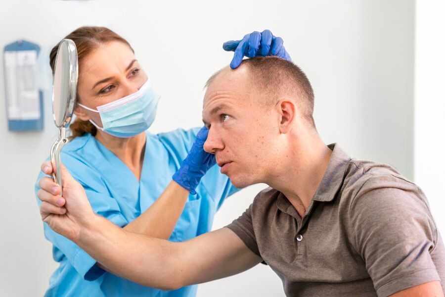 Man going through follicular unit extraction process