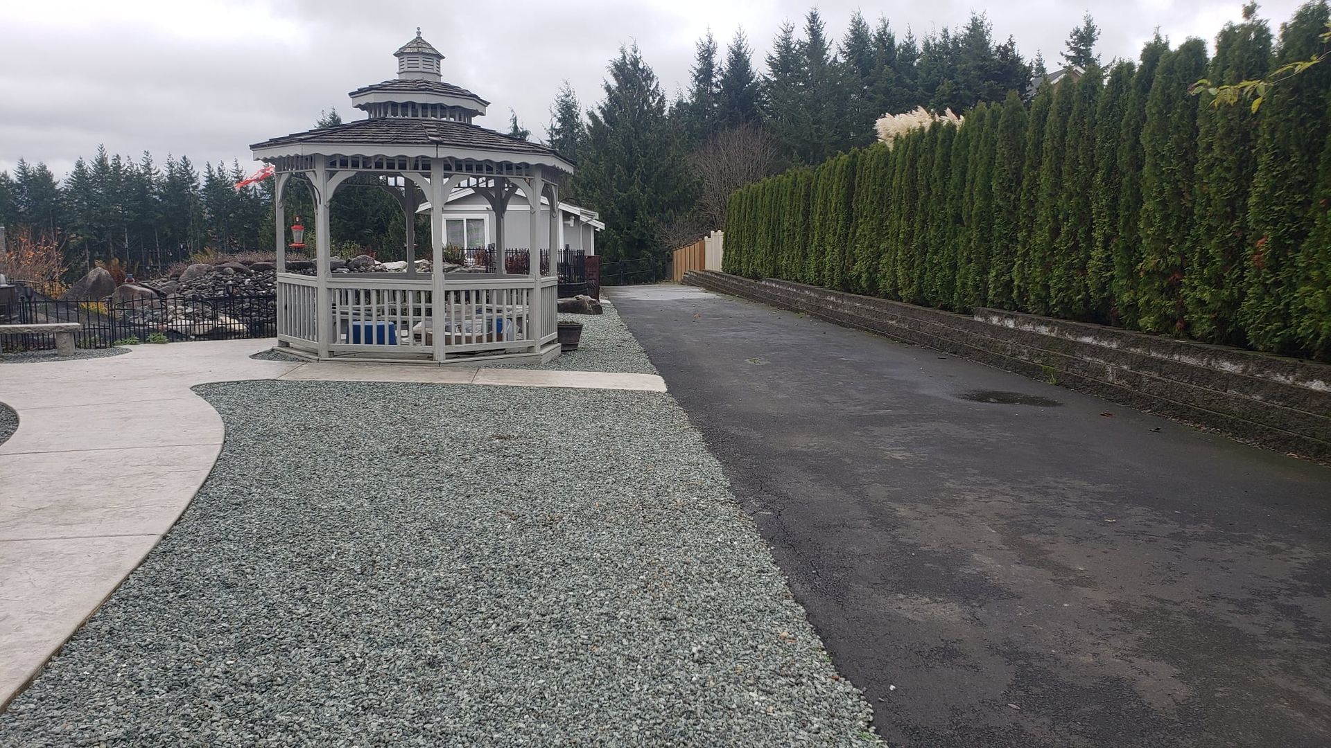 A person in a white apron is working in a kitchen