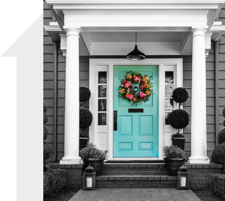 A house with a bright blue front door.