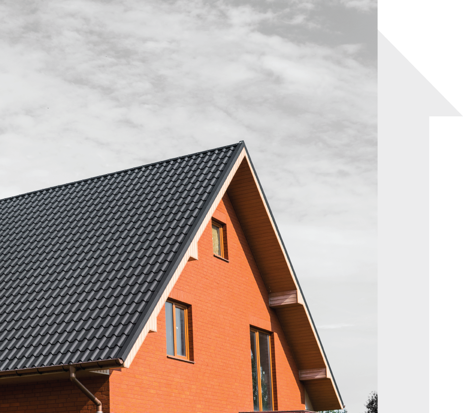 A red house with a black shingled roof.