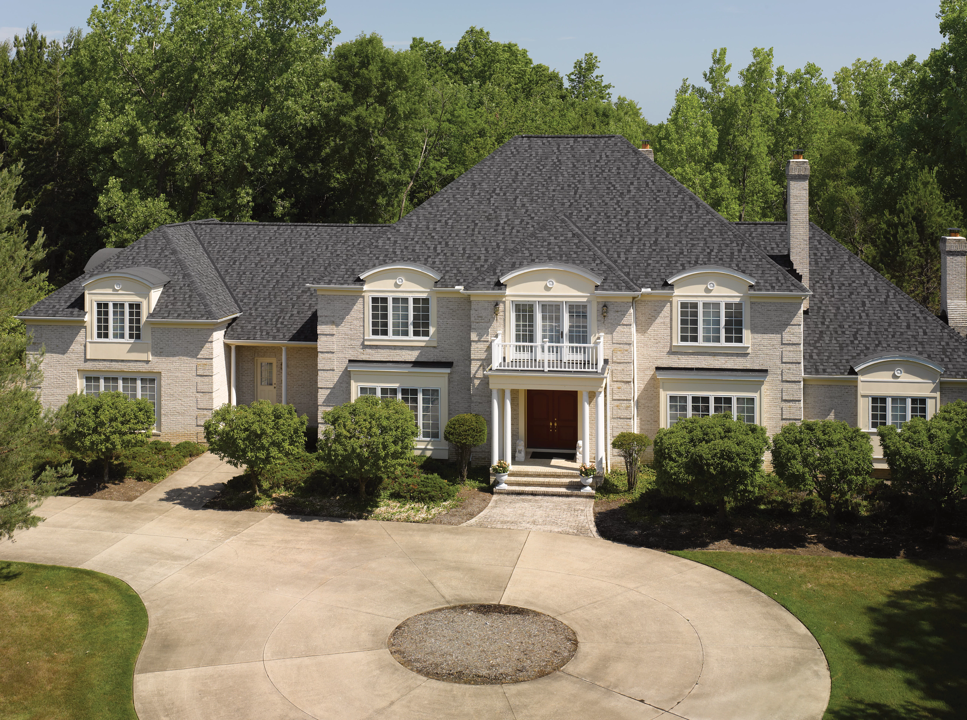 A large white house with a black roof