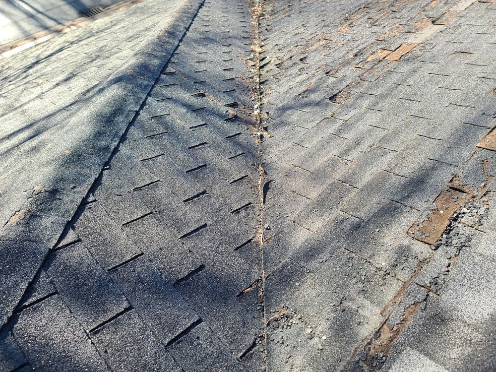 A close up of a roof with a lot of nails on it.