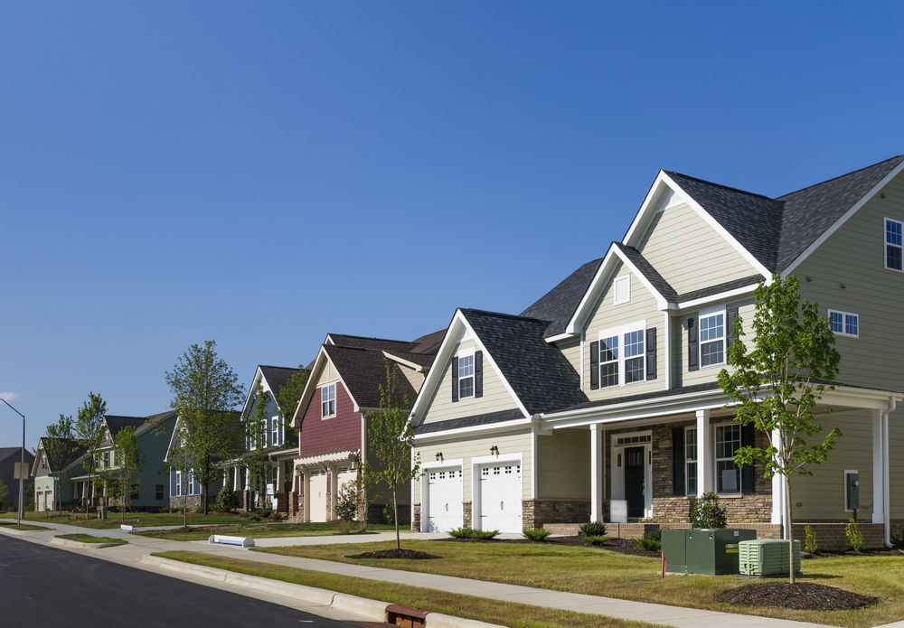 houses with different colored siding in a neighborhood