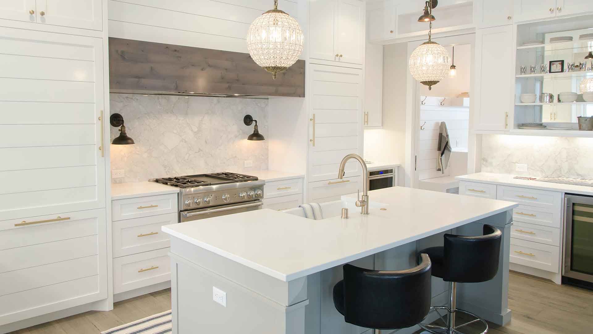 There is a large island in the middle of the kitchen.
