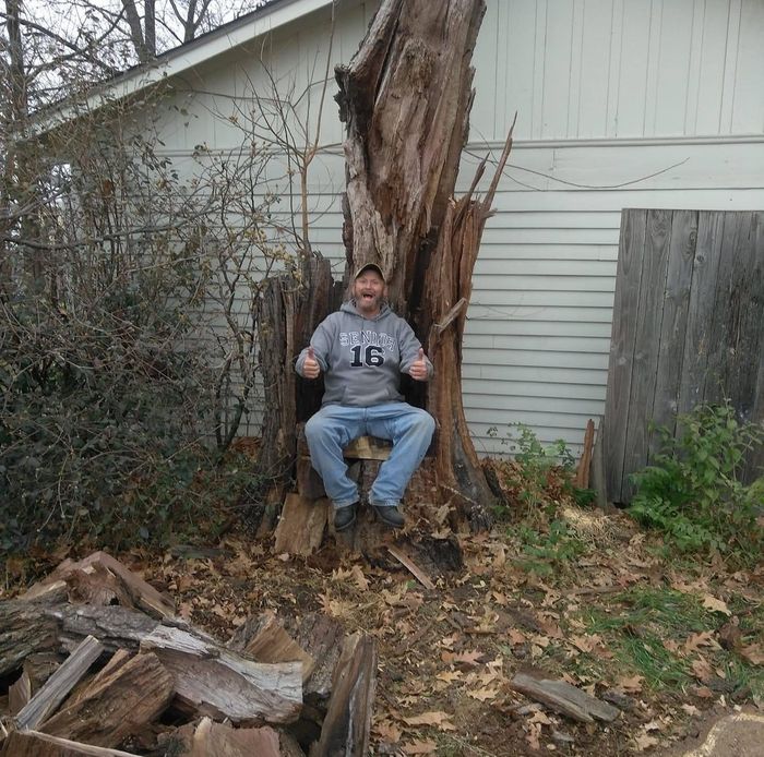 Man Sitting On A Damaged Tree — Kansas City, MO — Shier’s Family Tree Service