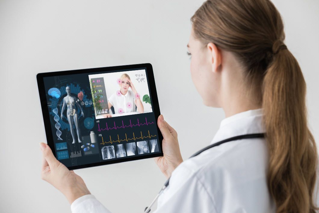 A doctor conducting a telehealth visit using a mobile device