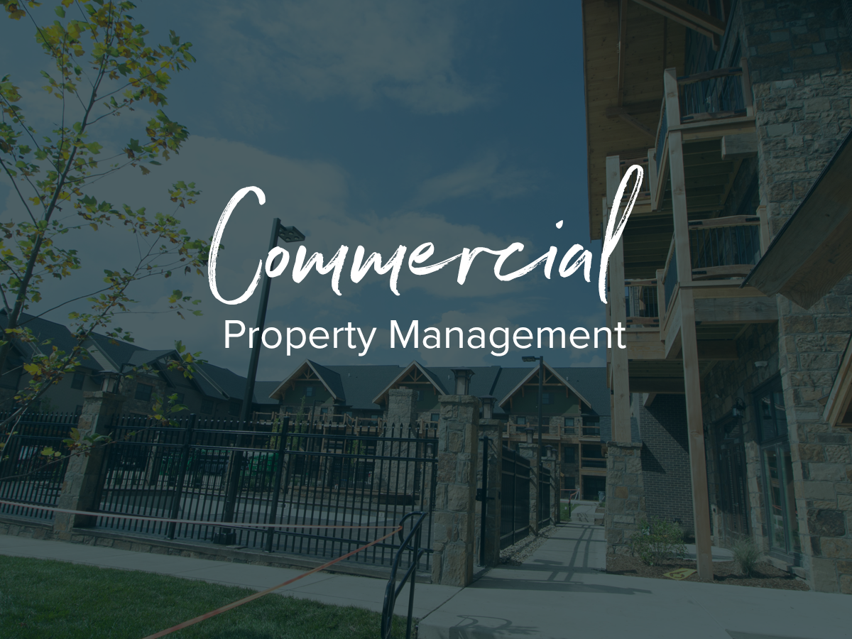 A picture of a building that says commercial property management