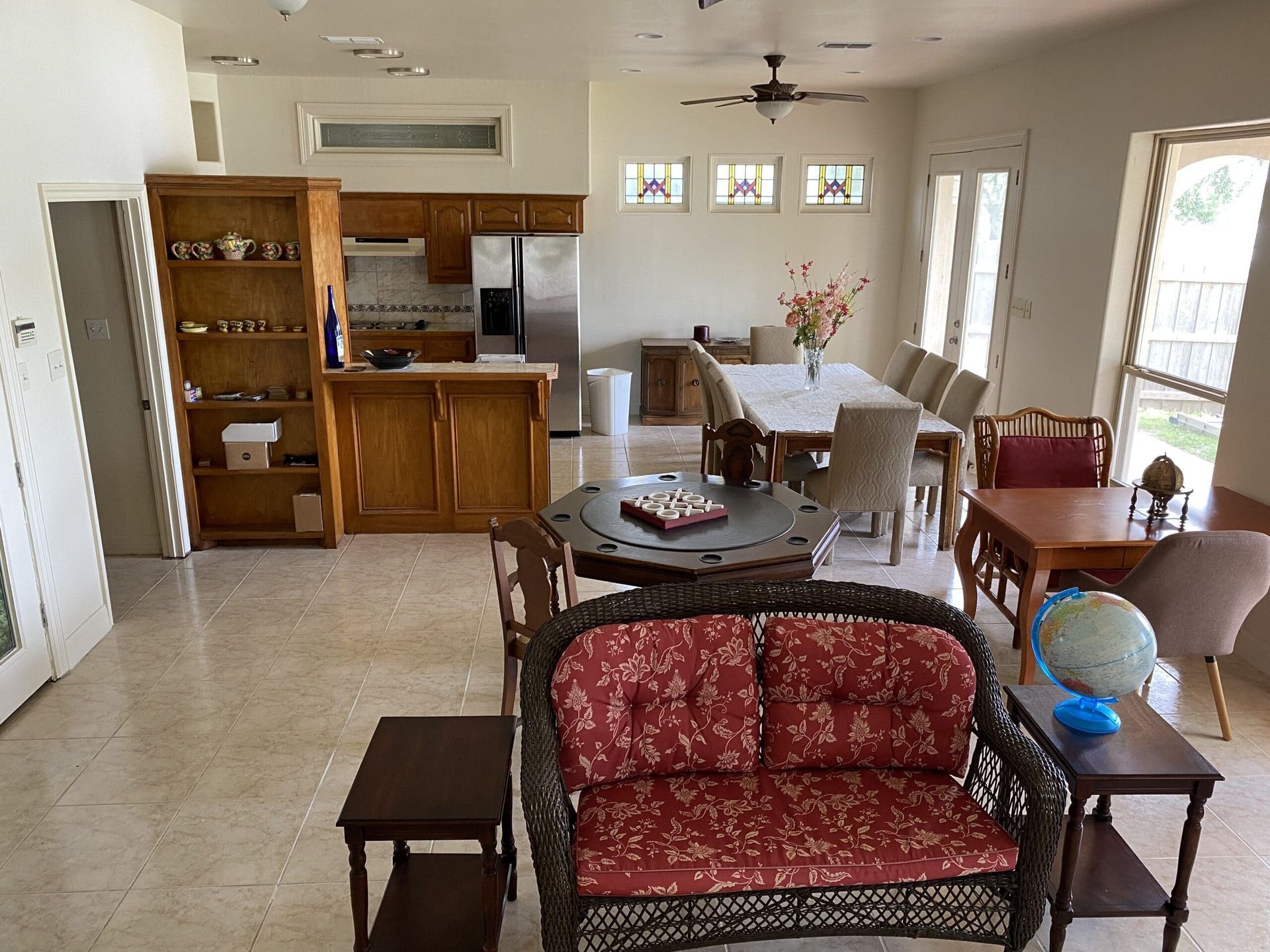 A living room with a couch a table and chairs