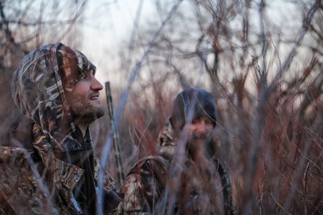  Men in camouflage suits.