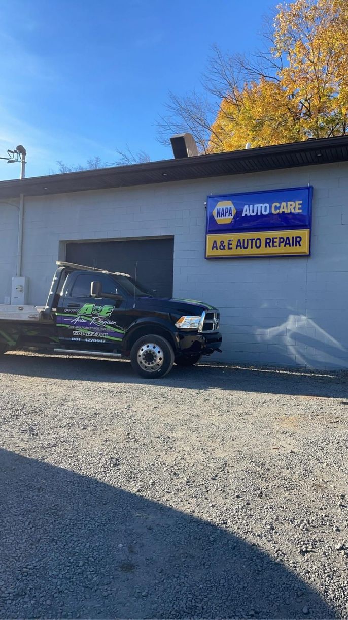 Shop front with tow truck parked