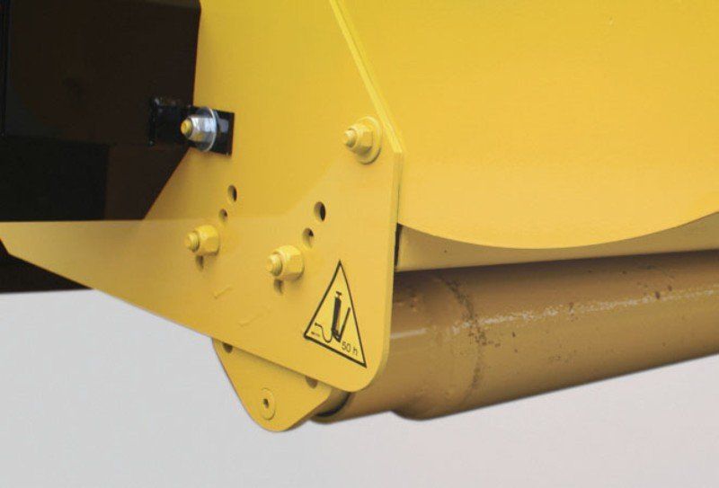 Eine Nahaufnahme eines gelben Objekts mit einem Warnschild darauf