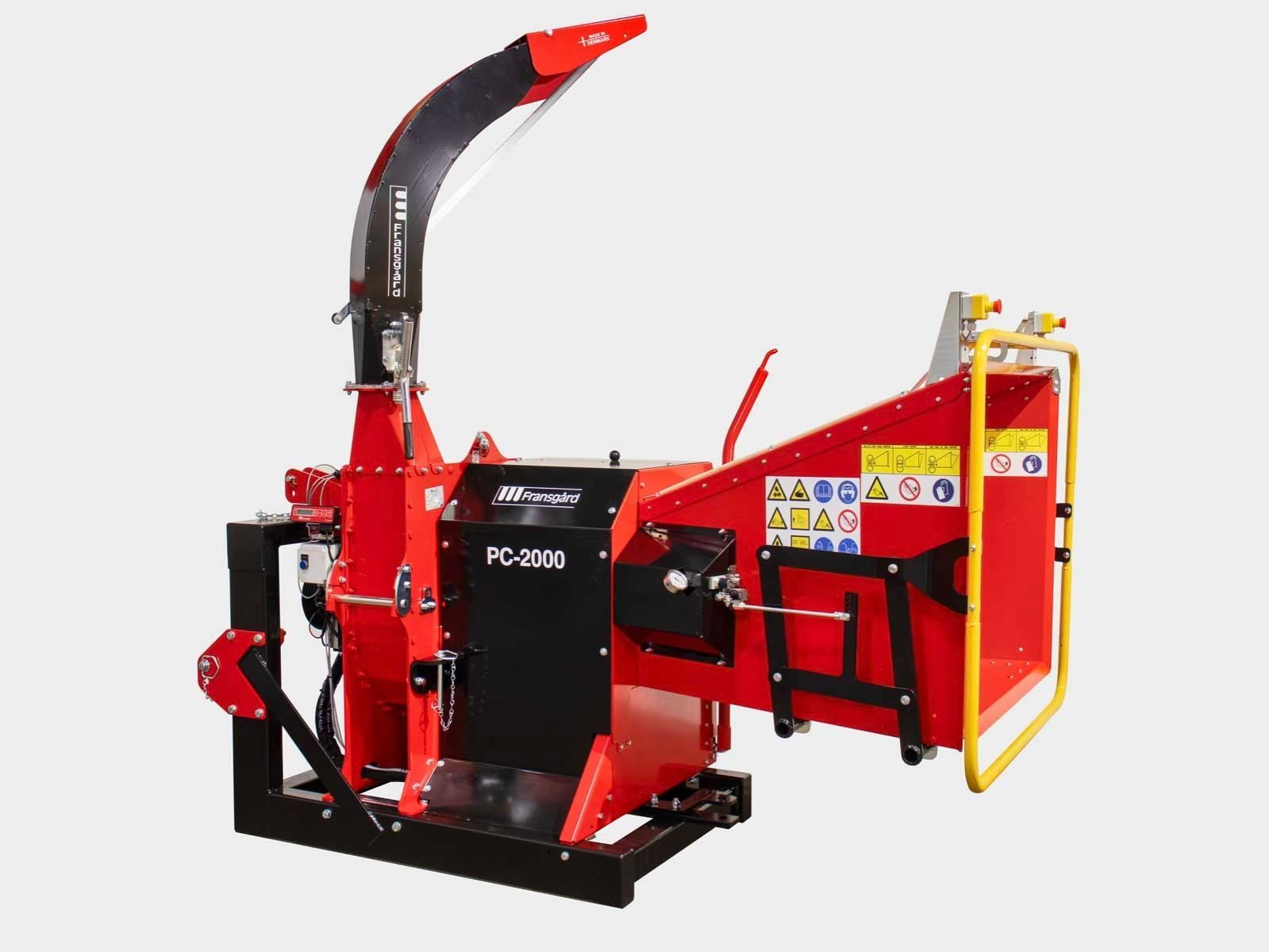 Eine rot-schwarze Maschine steht auf einer weißen Fläche.